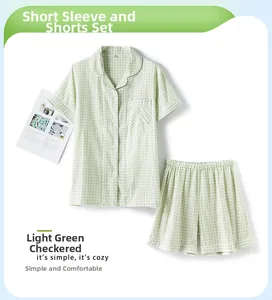 Detailed flat lay of light green gingham short sleeve cotton pajama set with shirt and shorts