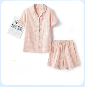 Short sleeve pink plaid cotton pajama set with button-down top and elastic shorts