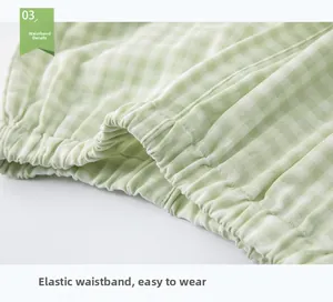 Detail view of the green checkered cotton pajama elastic waistband for comfortable wear