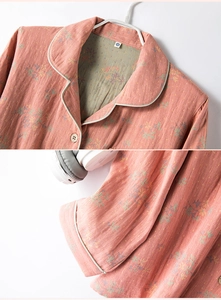 Detail of floral pink cotton pajama top with contrast piping and soft jacquard texture
