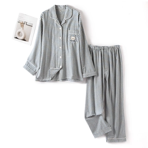 Blue and white plaid cotton pajama set for couples featuring cute bear embroidery detail