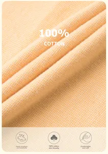 Detail of 100% cotton fabric texture showing soft breathable weave on orange lounge wear