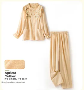 Detail of apricot cotton pajama with floral embroidery and waffle texture fabric