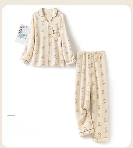 Detail of beige quilted pajama set featuring cute brown rabbit patterns and textures