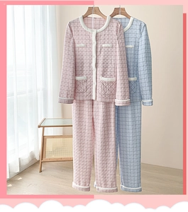 Detail of quilted loungewear set featuring soft diamond pattern and plush white trim borders