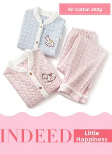 Detail of 300g quilted cotton pajama sets in pink and blue with horse embroidery
