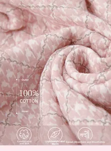 Detail of pink houndstooth quilted fabric with 100% cotton texture for cozy homewear