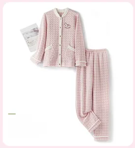 Close-up of quilted oak pink women's pajama set featuring horse embroidery and button detail