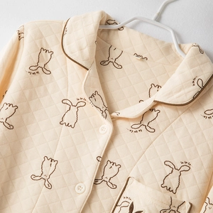 Quilted cream loungewear top with brown rabbit patterns and cozy long sleeves