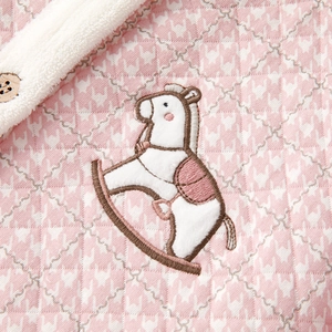 Pink quilted pajama set with rocking horse embroidery and wooden button details