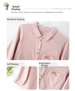 Détail du haut de pyjama en coton rose avec broderie cœur, revers et boutons en bois