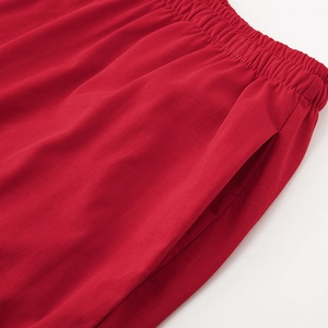 Red mercerized cotton loungewear pants with elastic waist and pockets for couples