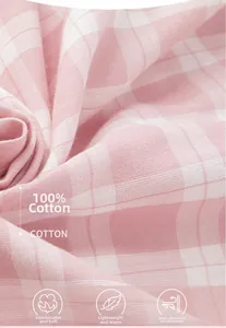 Dettaglio macro del tessuto a quadri rosa e bianco in morbida trama 100% cotone