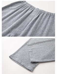 Dettaglio dei pantaloni del pigiama in cotone a spina di pesce con elastico in vita e orlo