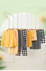 Close-up of double gauze cotton pajamas featuring round neck and button-down plaid texture
