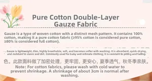 Detail showing 100% double-layer cotton gauze fabric texture and washing instructions