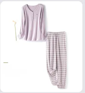 Detail view of cotton rib knit pajama set in misty purple with embroidered bird and plaid pants