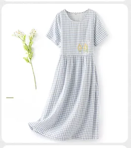 Close-up of bird embroidery on light blue checkered cotton short sleeve nightgown