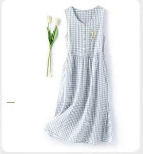 Detail of sea salt blue cotton nightdress with daisy embroidery and plaid pattern