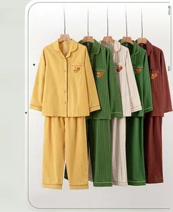 Detail view of cotton striped pajama sets with squirrel embroidery in four colors