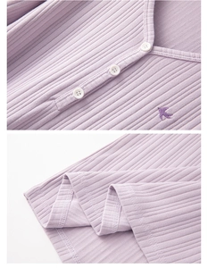 Detail of ribbed knit cotton pajama top with V-neck, buttons and swallow embroidery