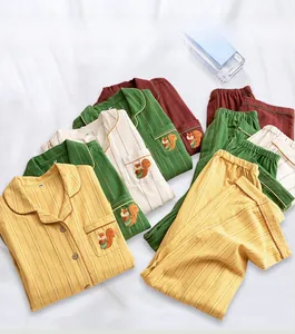 Close-up of four-color striped cotton pajamas set featuring exquisite squirrel embroidery