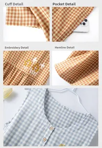 Detail view of plaid cotton dress featuring embroidered bird motif and side pockets