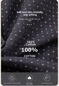 Detail of black quilted cotton fabric with white dots and diamond stitch texture