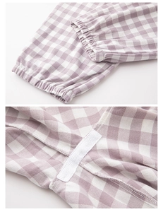 Detail of purple gingham cotton fabric showing elastic cuff and reinforced inner stitching