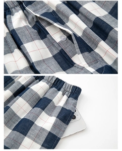 Detail of blue plaid cotton pajamas showing elastic waistband and functional side pockets