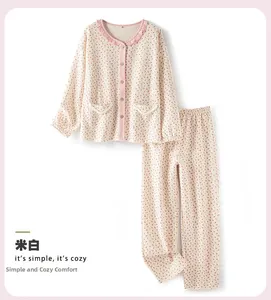 Detail of off-white floral pajamas showing ruffled collar and quilted texture