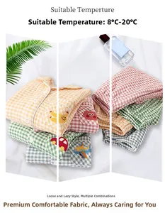Close-up of quilted cotton pajama sets with plaid patterns and cute embroidered patches