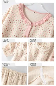 Close-up of pink floral quilted pajamas with ruffle neckline and diamond stitching texture