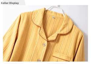 Close-up of the notched lapel and striped cotton texture on yellow pajama top