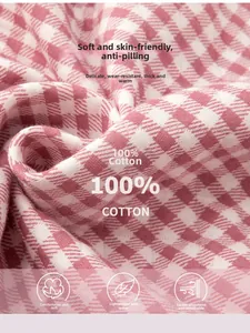 Detail of 100% cotton pink houndstooth quilted fabric with soft and breathable texture