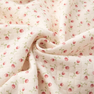 Floral quilted pajama set with red flower pattern and soft diamond stitching texture