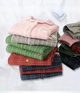 Close-up of quilted cotton pajama sets featuring cute embroidery and various color patterns