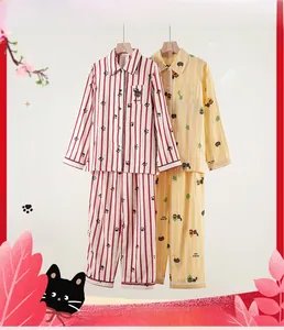 Detail of pure cotton double-layer gauze pajamas with striped cat claw and forest kitten prints