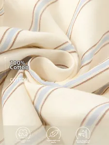 Close-up of 100% cotton fabric featuring soft light blue and brown stripes for comfort