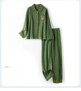 Detail of green striped pajama set with fox embroidery and quilted texture fabric