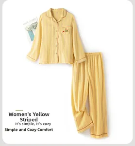 Flat lay of yellow striped cotton pajamas featuring a cute dog embroidery on the pocket