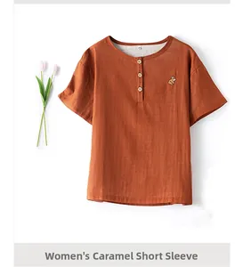 Detail of caramel cotton gauze short sleeve shirt with French bulldog embroidery and buttons