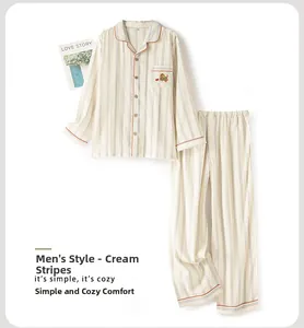 Detail of men's cotton striped pajama set featuring chest pocket with bear embroidery