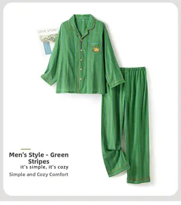 Detailed view of men's green striped cotton pajamas with orange cat embroidery on pocket