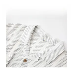 Close-up of lapel collar on gray striped cotton pajama set with wood grain button