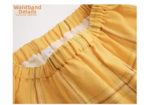 Detail view of elastic waistband on yellow plaid cotton pajama set with size M label
