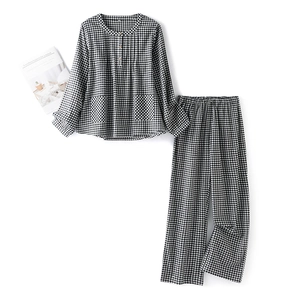Women's plaid cotton pajama set with long sleeves, buttoned collar and twin front pockets