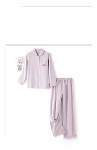 Detailed view of women's purple brushed cotton pajamas with cartoon embroidery