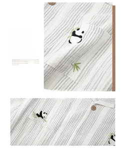 Close-up of cute panda embroidery on striped cotton crepe pajama with wooden button