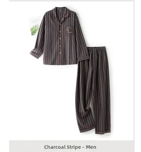 Flat lay of men's charcoal gray striped brushed cotton pajamas with red contrast piping